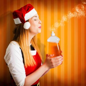 Beautiful christmas girl finishing cleaning chores